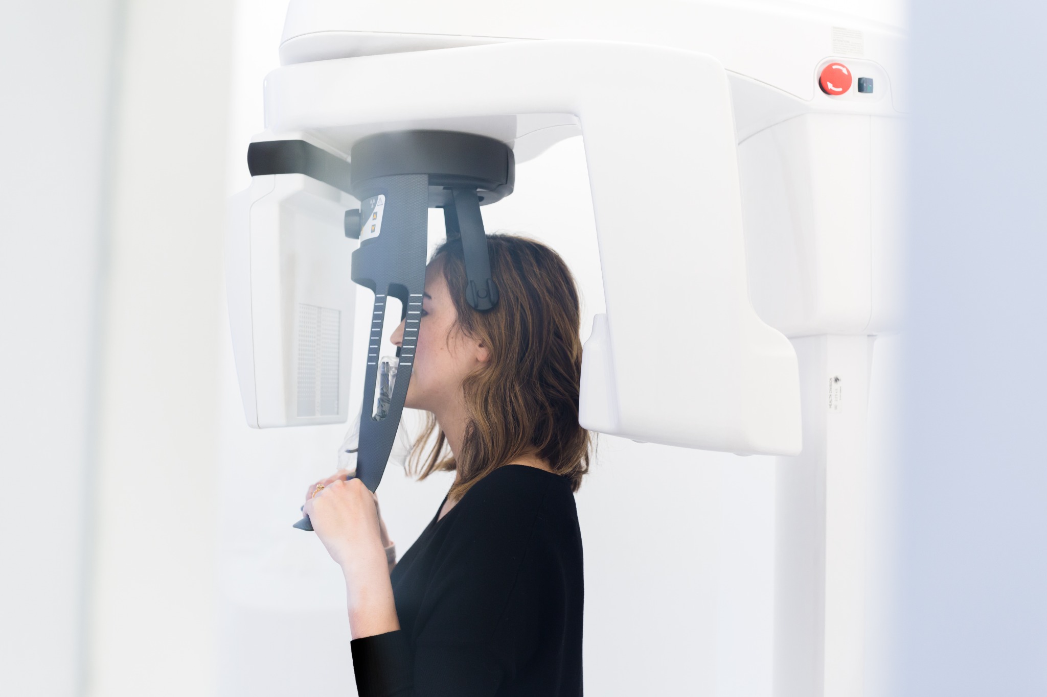 Patient positioned in advanced dental imaging equipment